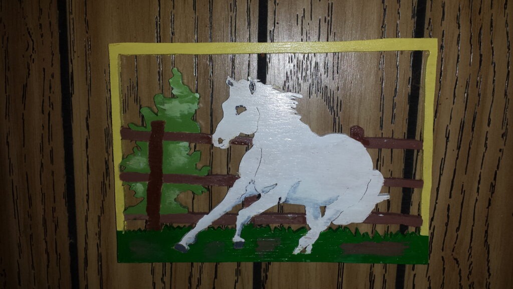 Handcrafted Wooden Wall Art of a White Horse Running in a Fenced Field