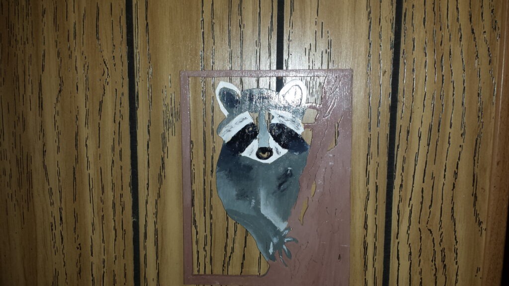 Handcrafted Wooden Wall Art Featuring a Painted Raccoon