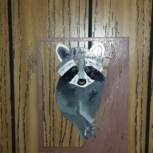 Handcrafted Wooden Wall Art Featuring a Painted Raccoon