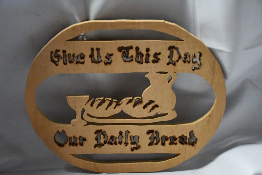 Handcrafted Wooden Plaque with the Phrase Give Us This Day Our Daily Bread